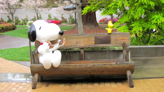 Snoopy and Woodstock sharing cookies in the garden at the Charles M. Schulz Museum.